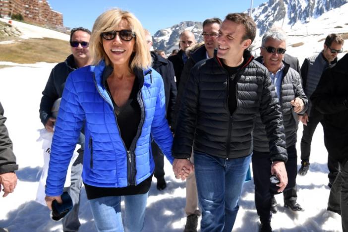 Emmanuel Macron, head of the political movement En Marche !, and his wife Brigitte Trogneux arrive for a lunch break at the mountain top during a campaign visit in Bagneres de Bigorre