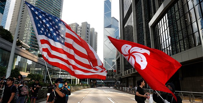 Trump signs Rights Bill, thousands stage ‘Thanksgiving’ rally in Hong Kong