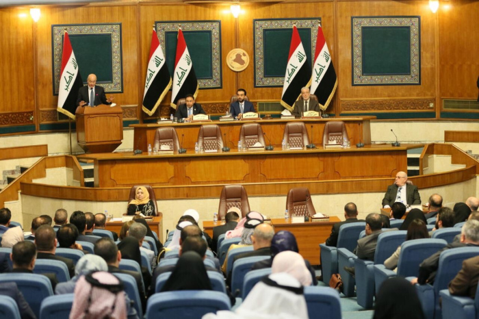 Iraqi parliament convening an extraordinary session against American troops