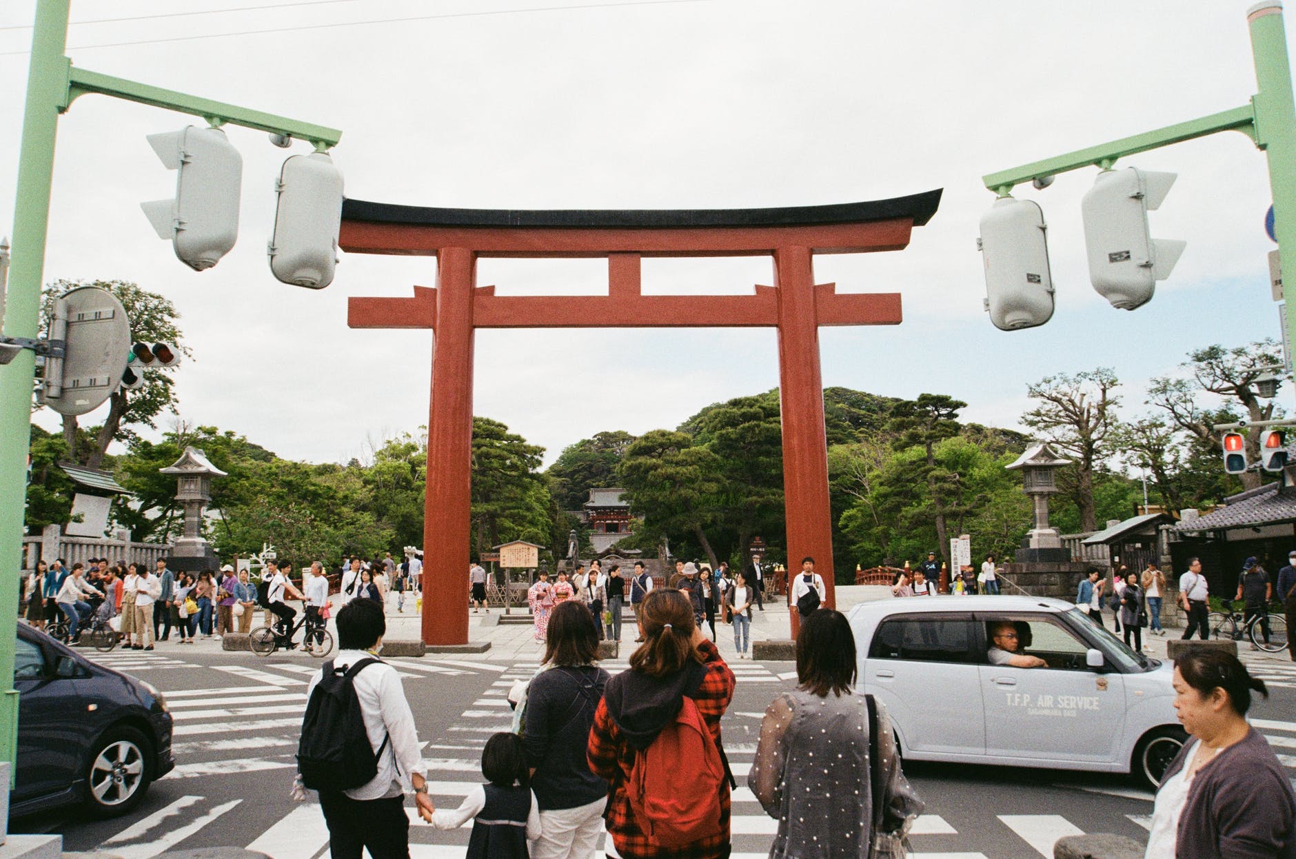 pedestrians waiting to cross a street