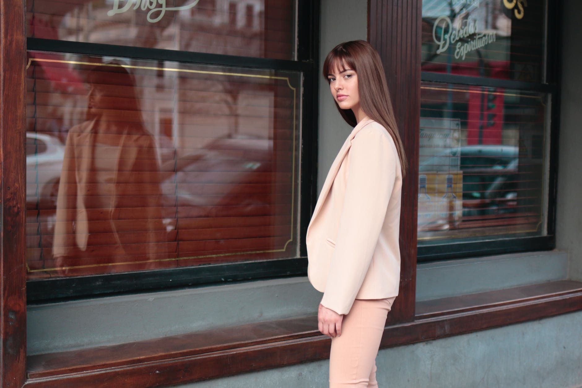woman wearing pink suit