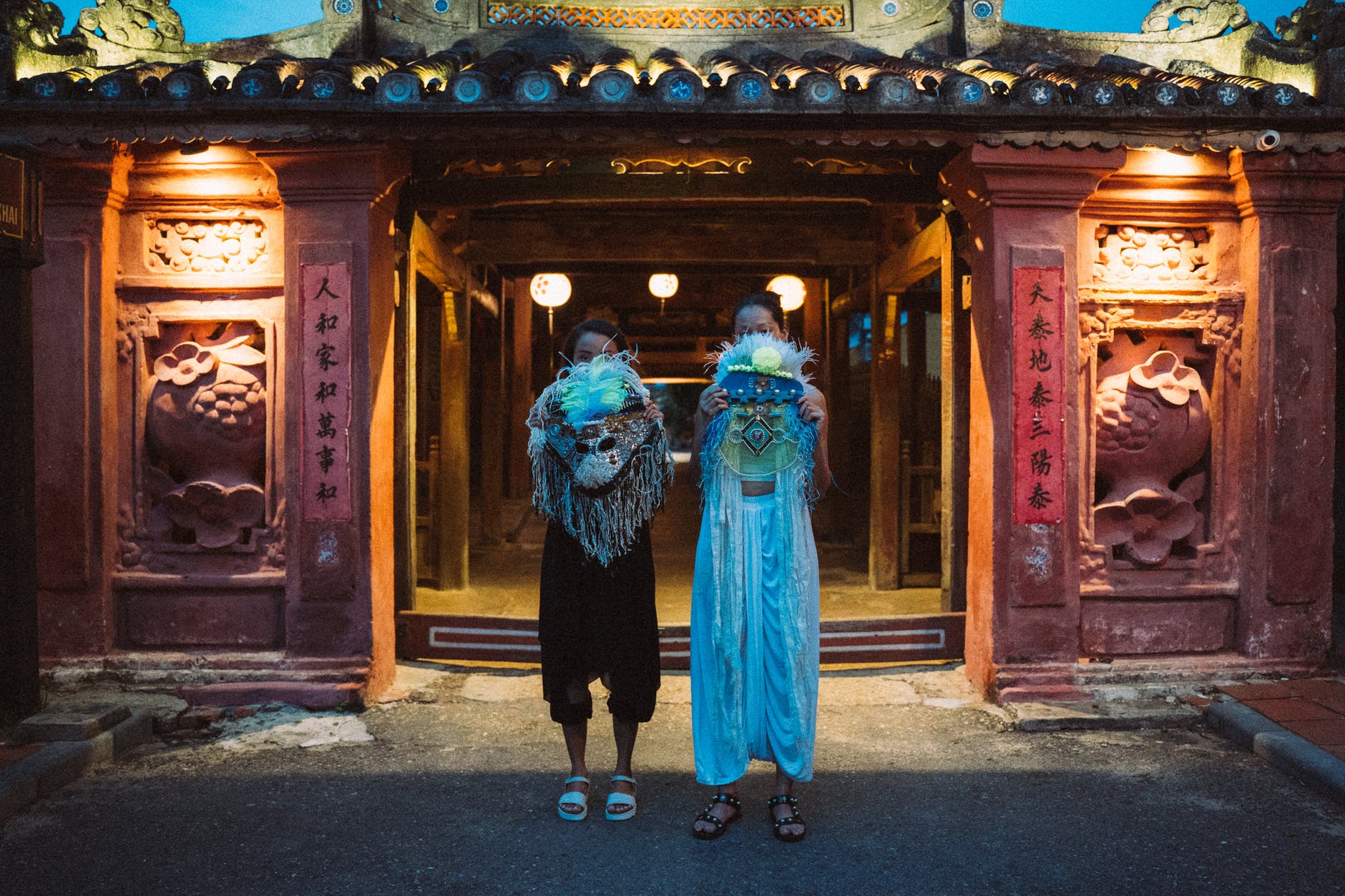 women holding festival masks