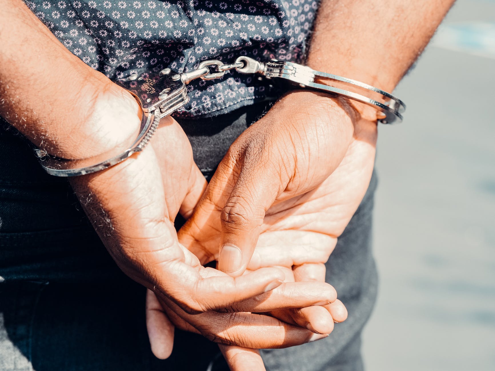 close up photography of person in handcuffs