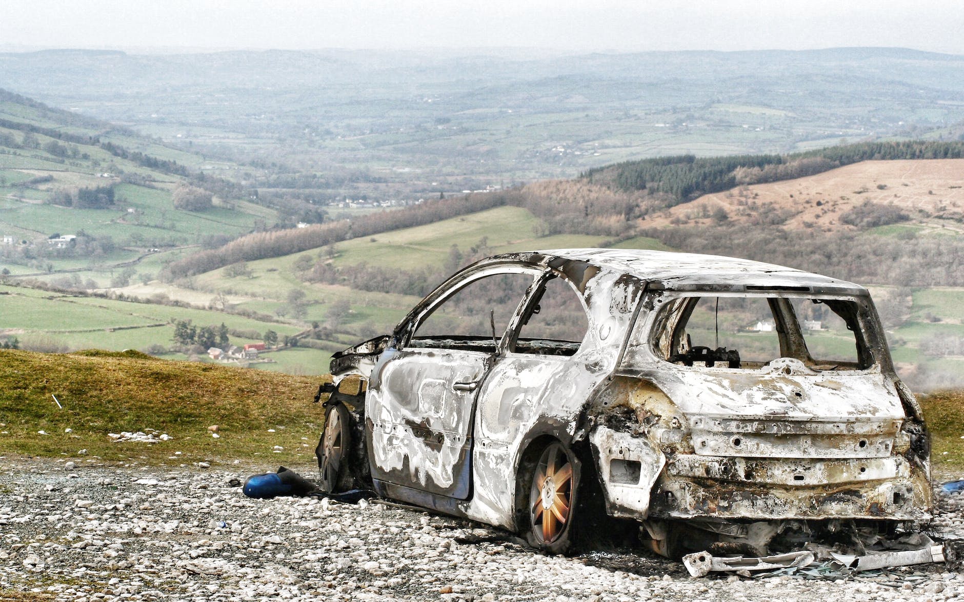a broken car parked outside