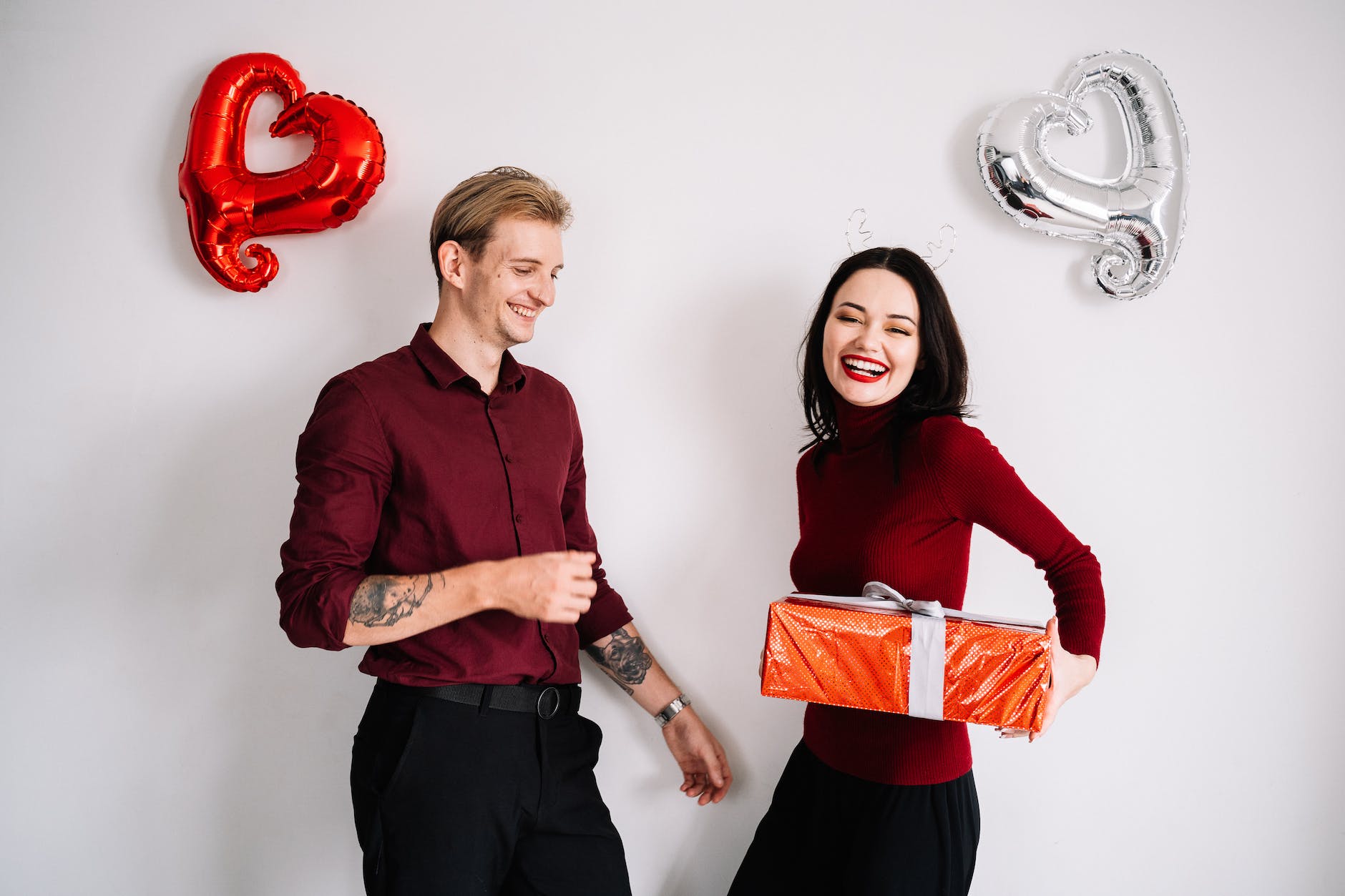 a woman giving a man a gift