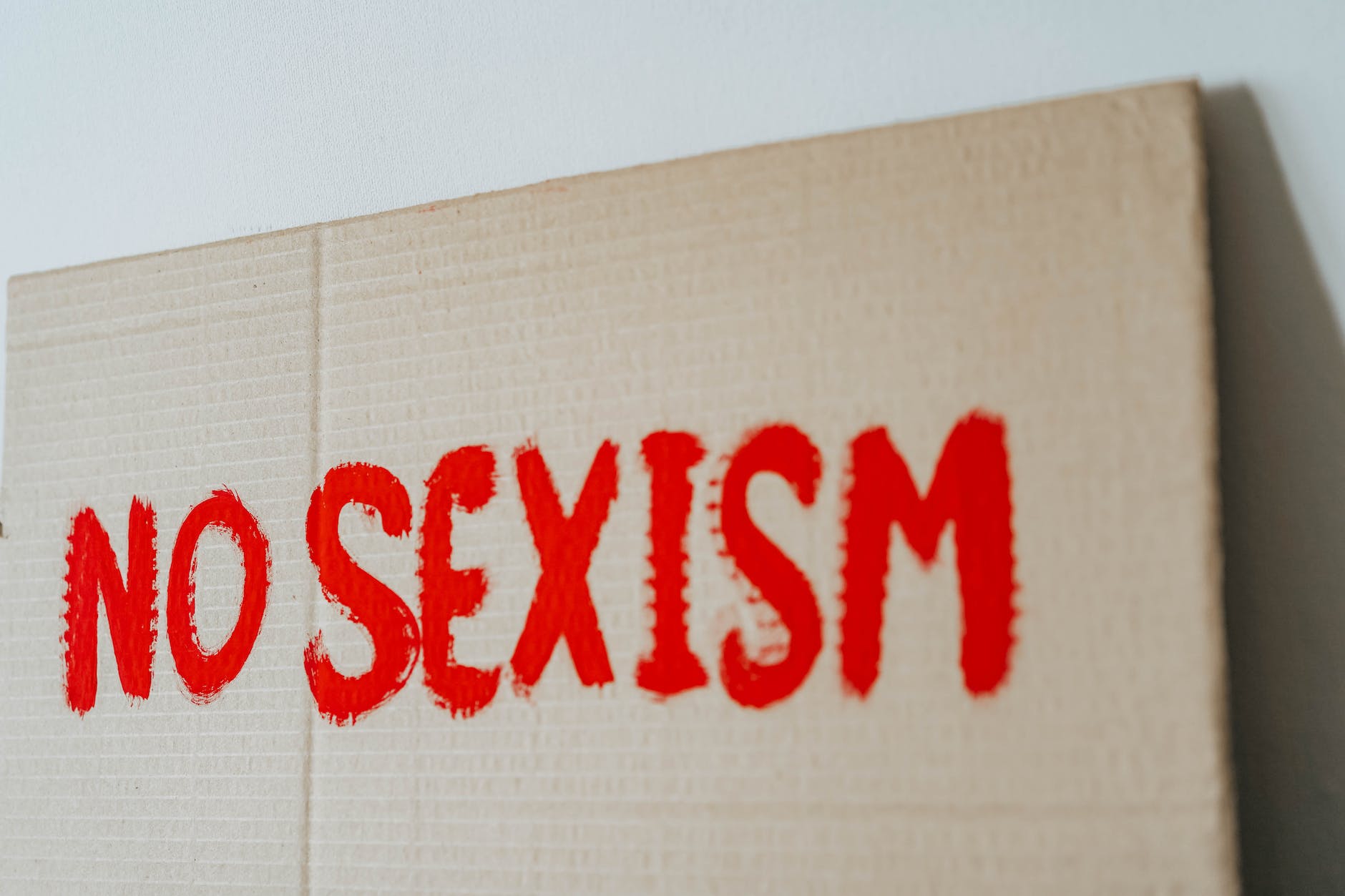 brown cardboard box with red paint