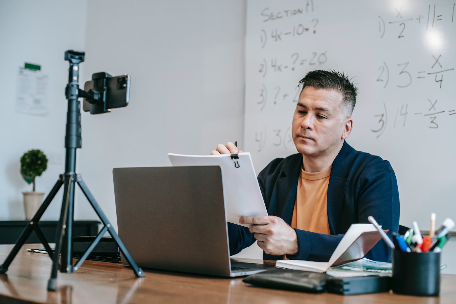 photo of man fixing paperworks
