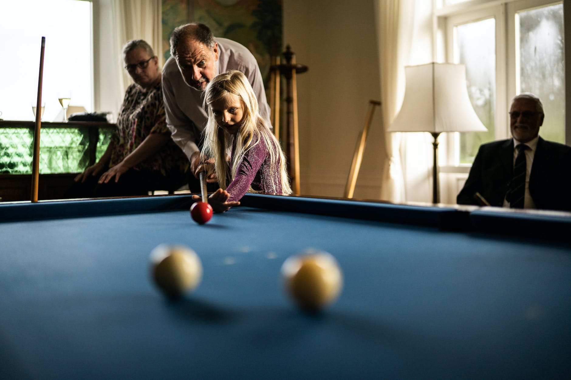 girl playing pool