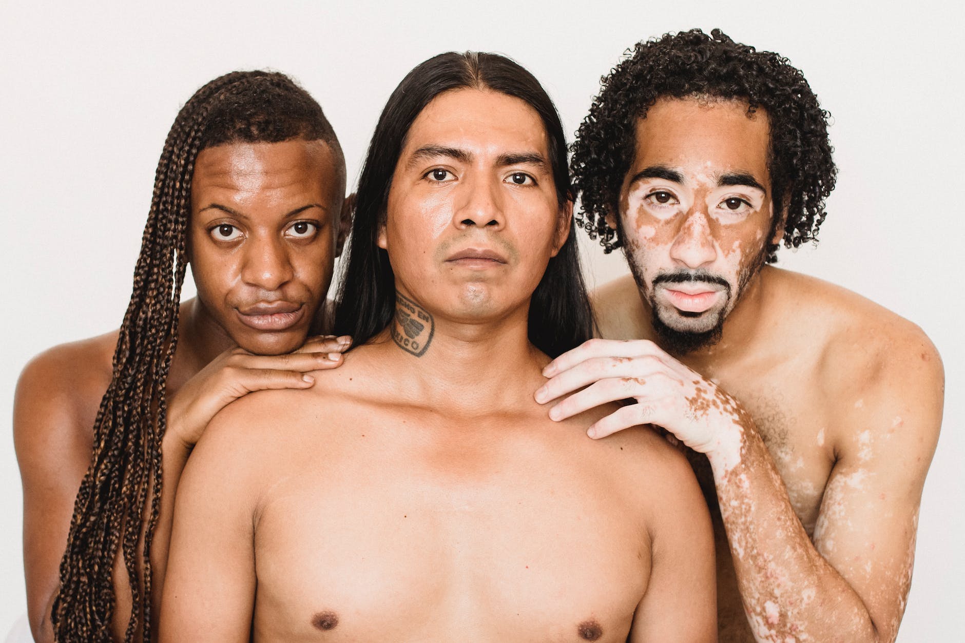feminine diverse shirtless men on white background