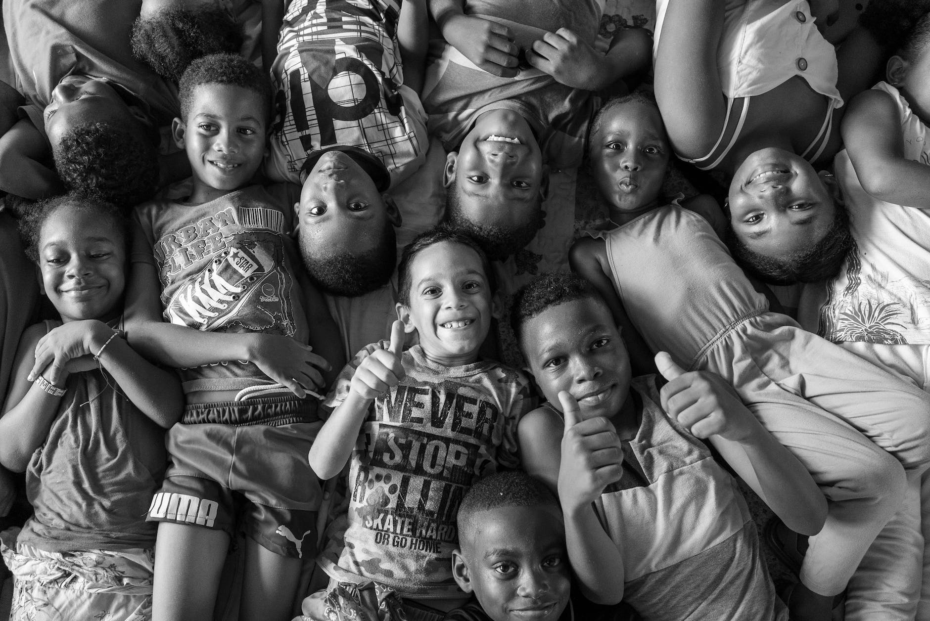 children lying down and posing together