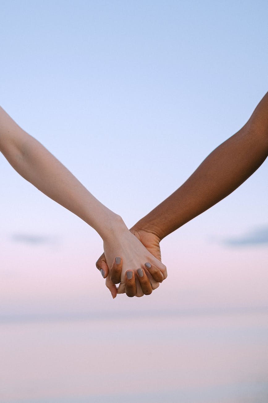 photo of people holding hands