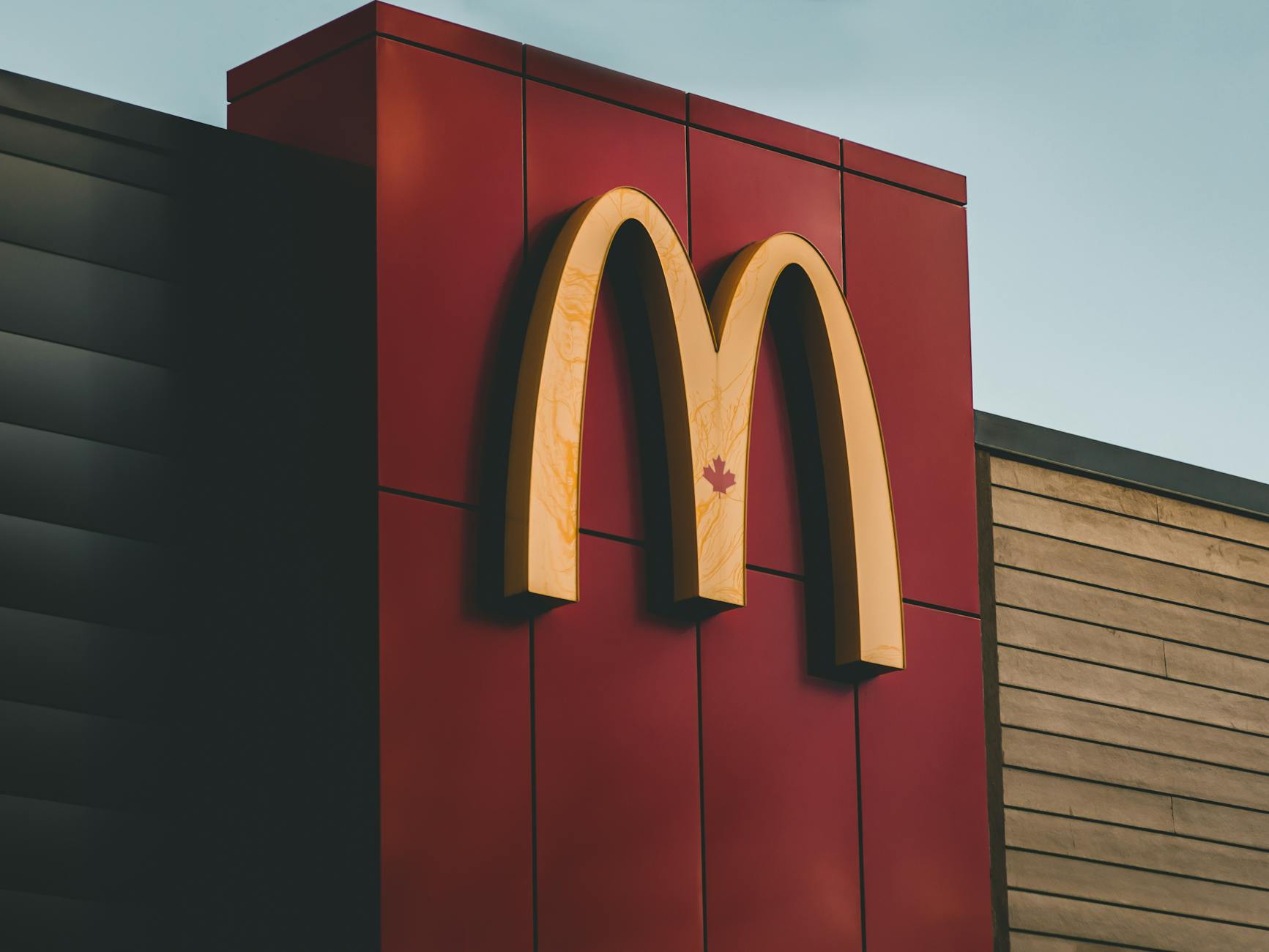 canadian maple leaf on wall with mcdonalds logo