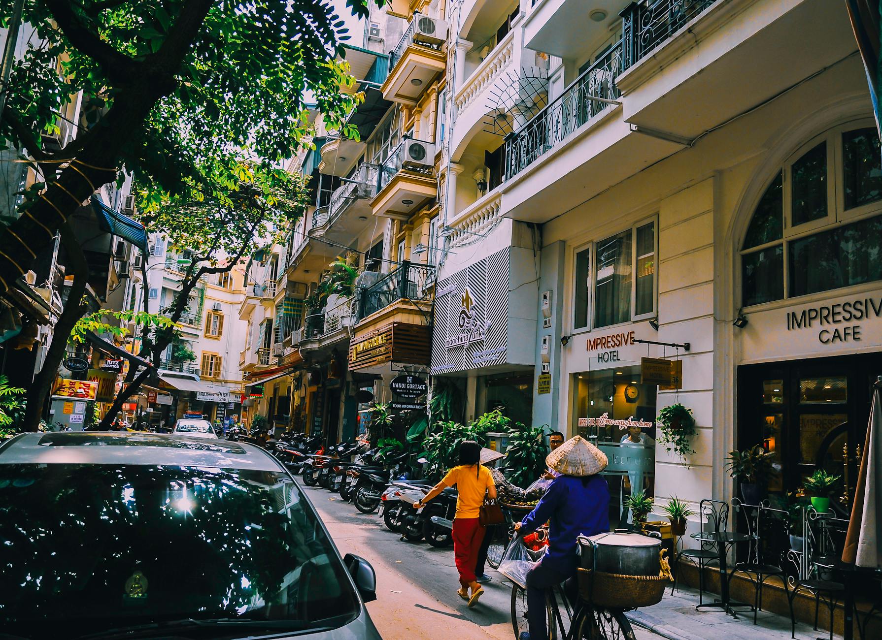 people walking in front of buildings