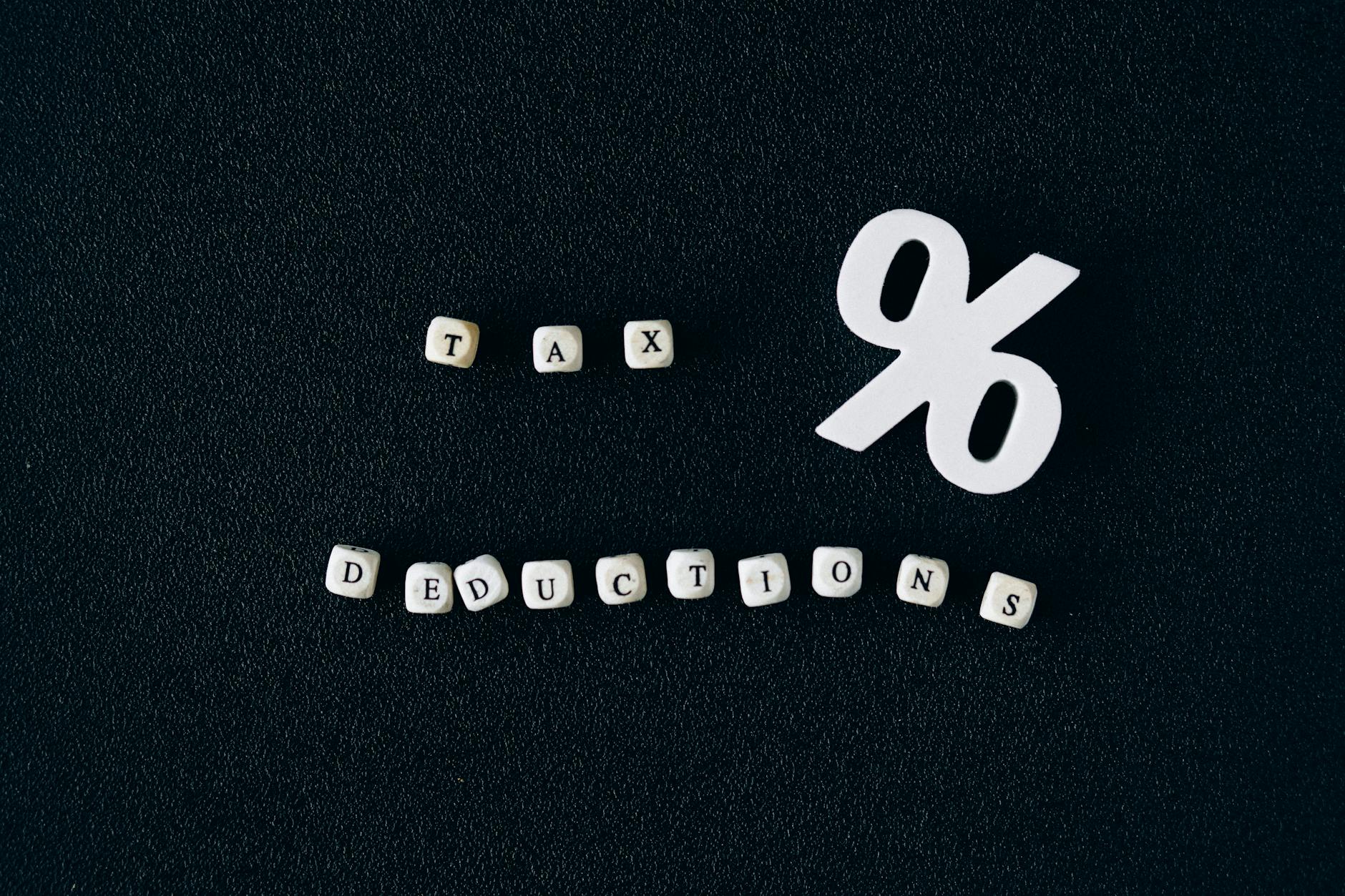 tax deductions words on black surface