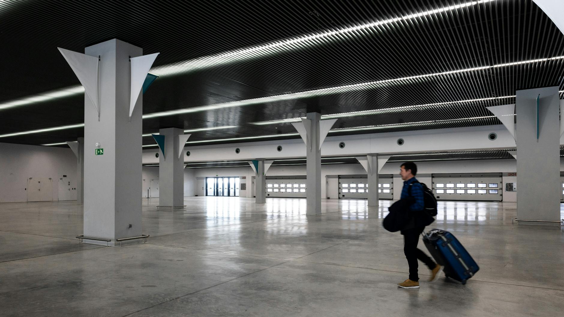 man walking in modern empty airport hall