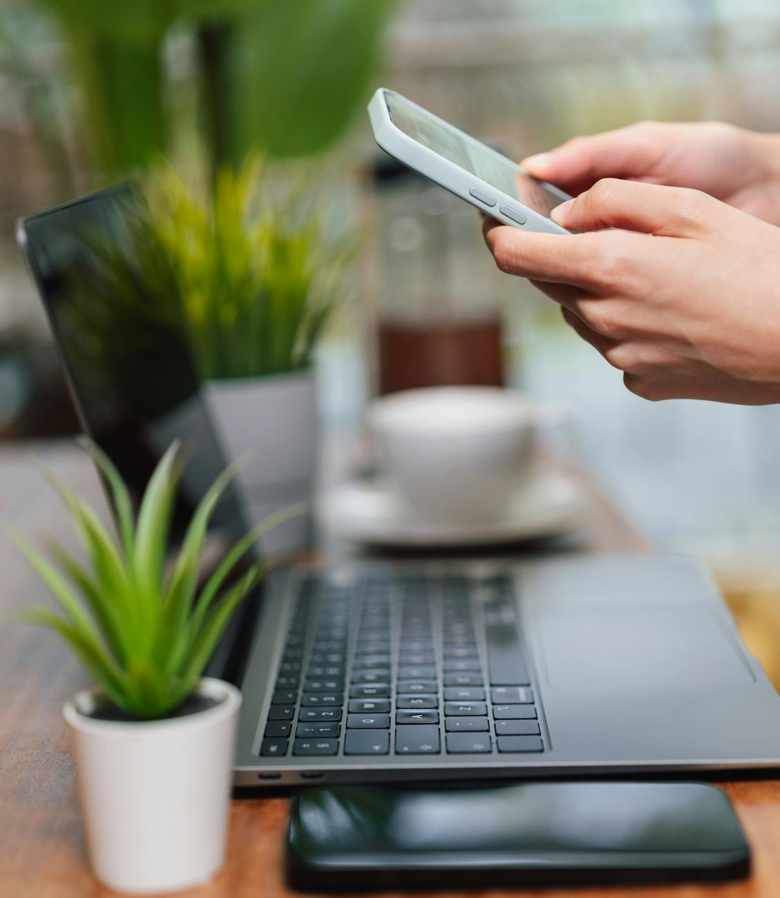 modern workspace with plants and devices