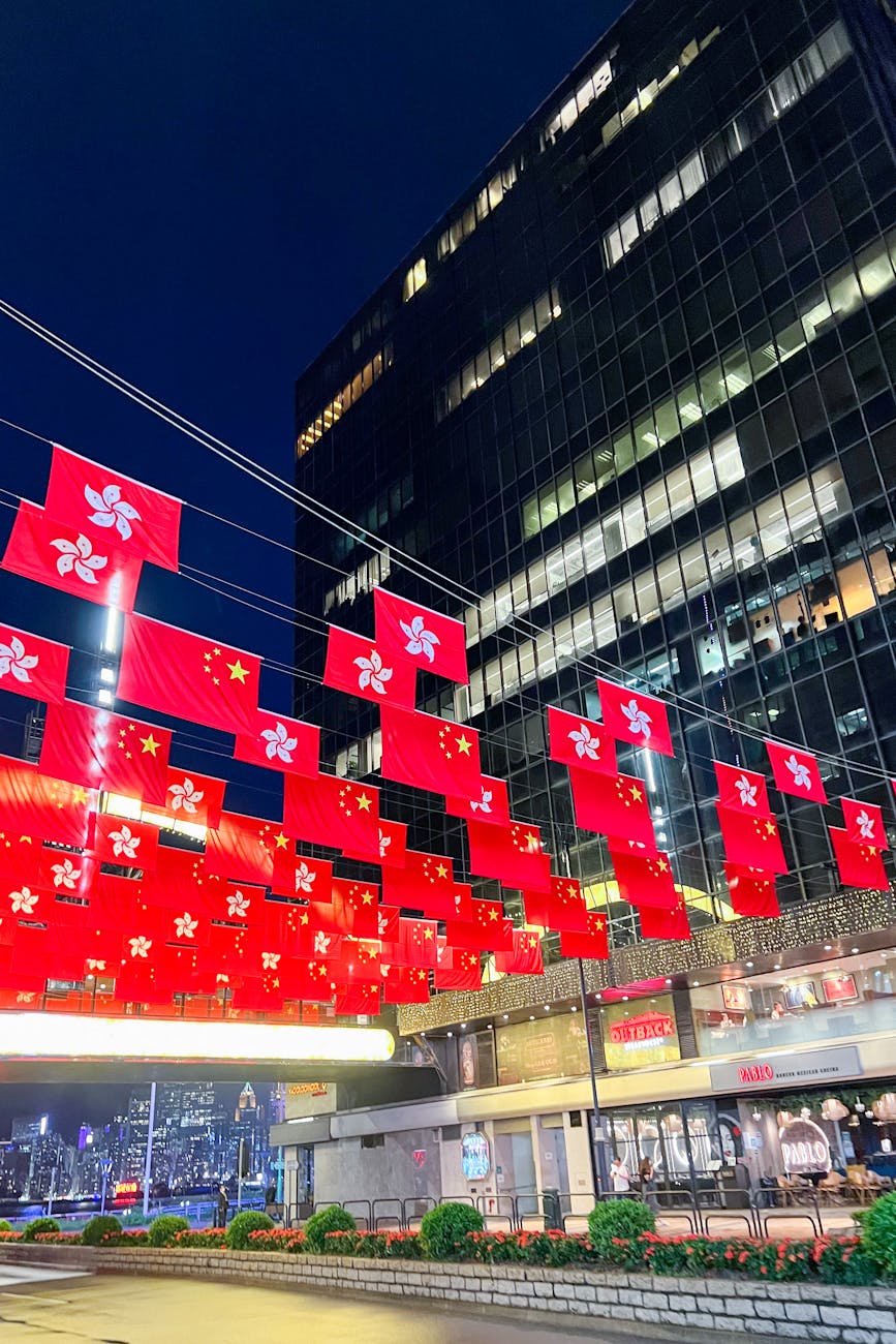 red flags over a street in a city