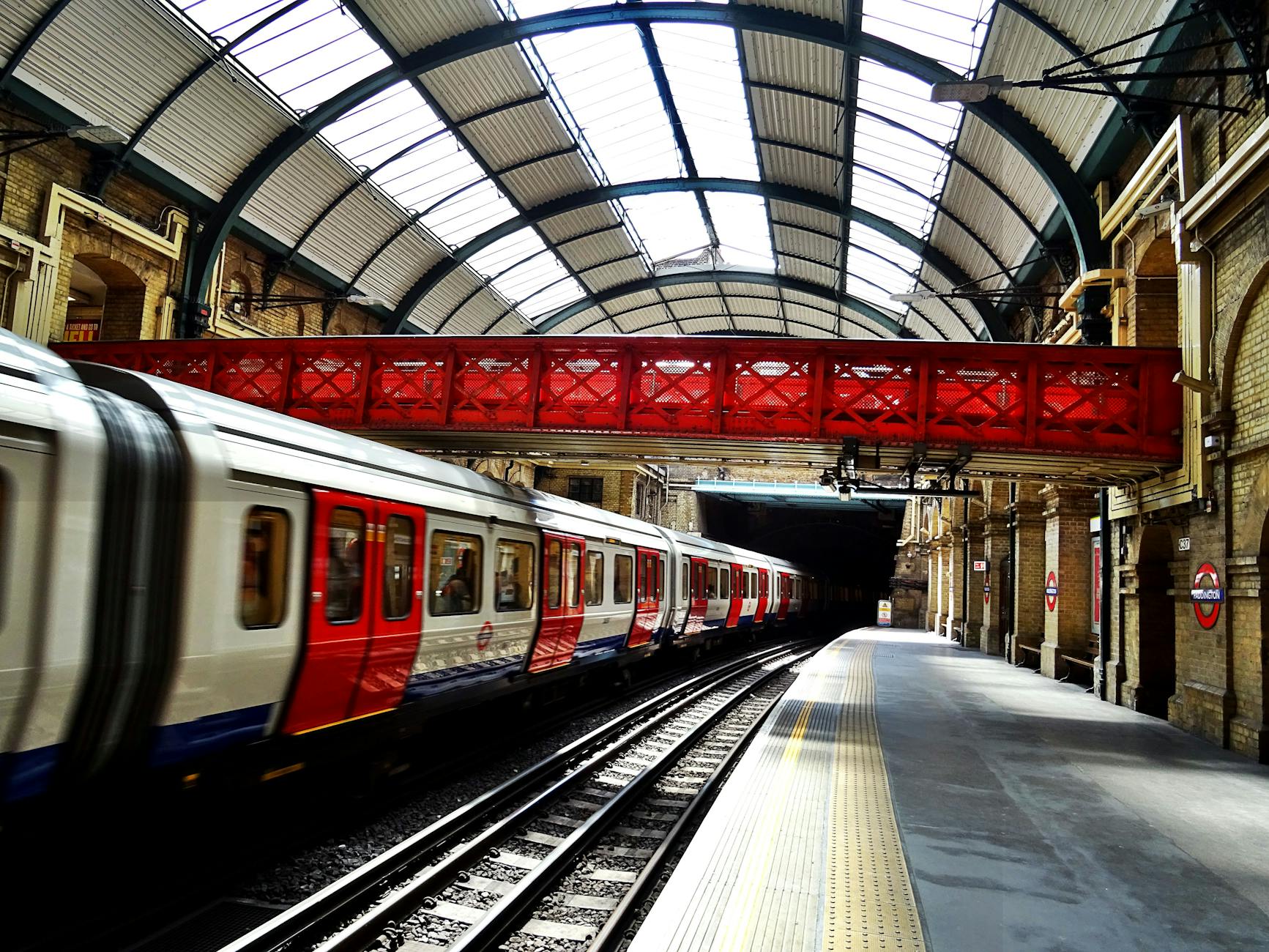 white and red train on station