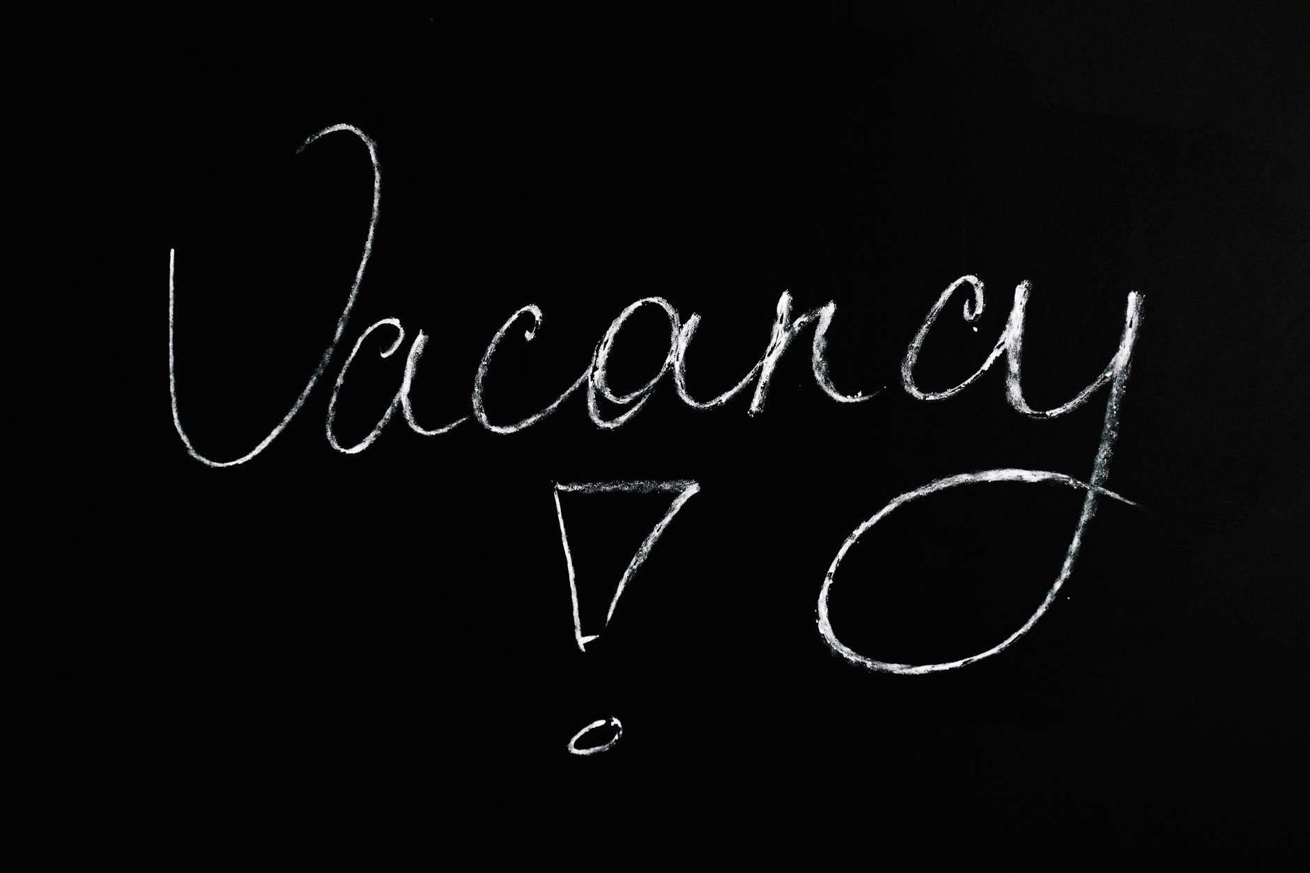 vacancy lettering text on black background