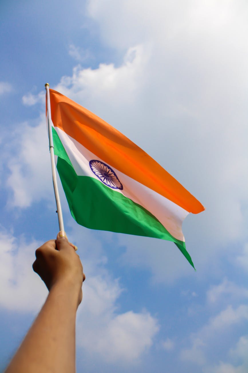 a person holding an indian flag