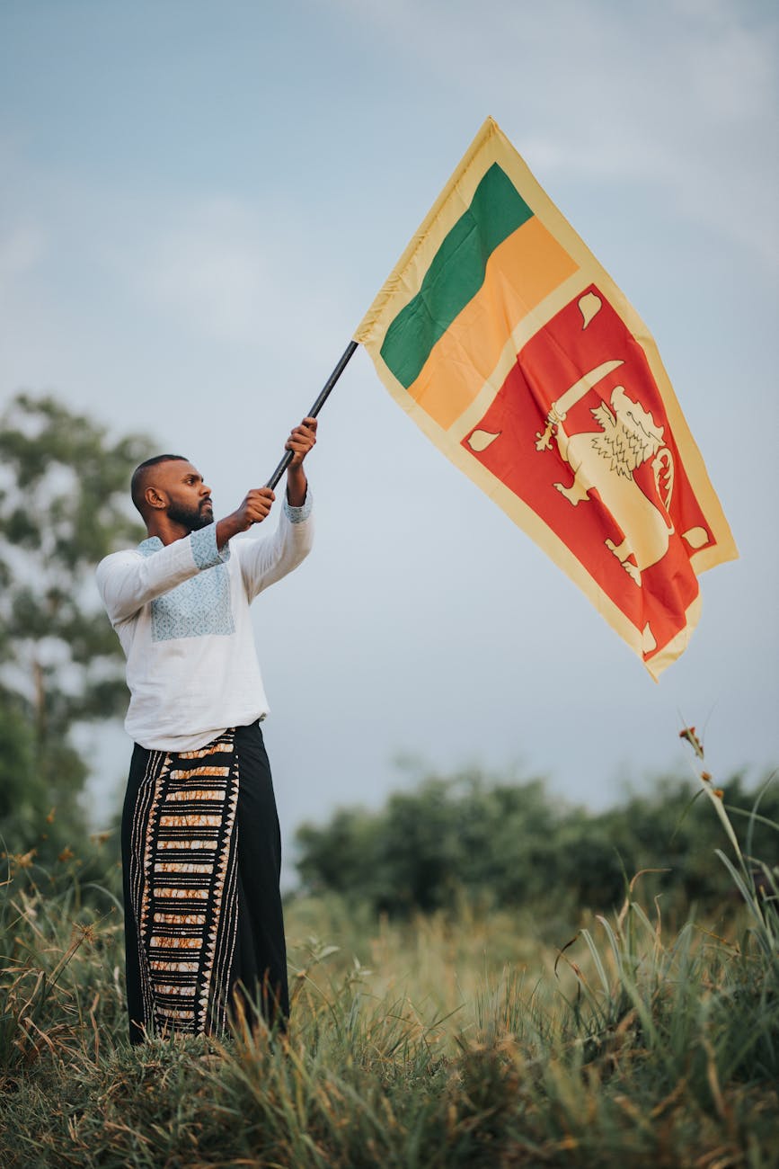 a man waving the flag of sri lanka