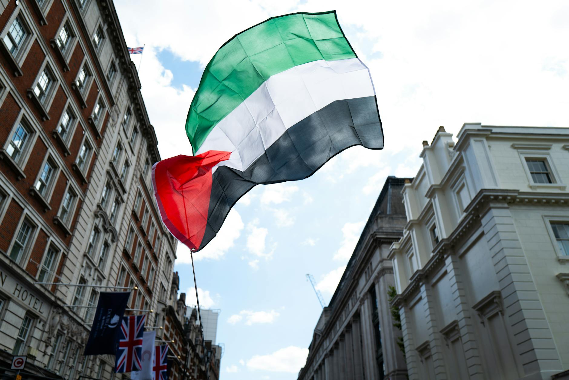 protest in london with palestinian flag