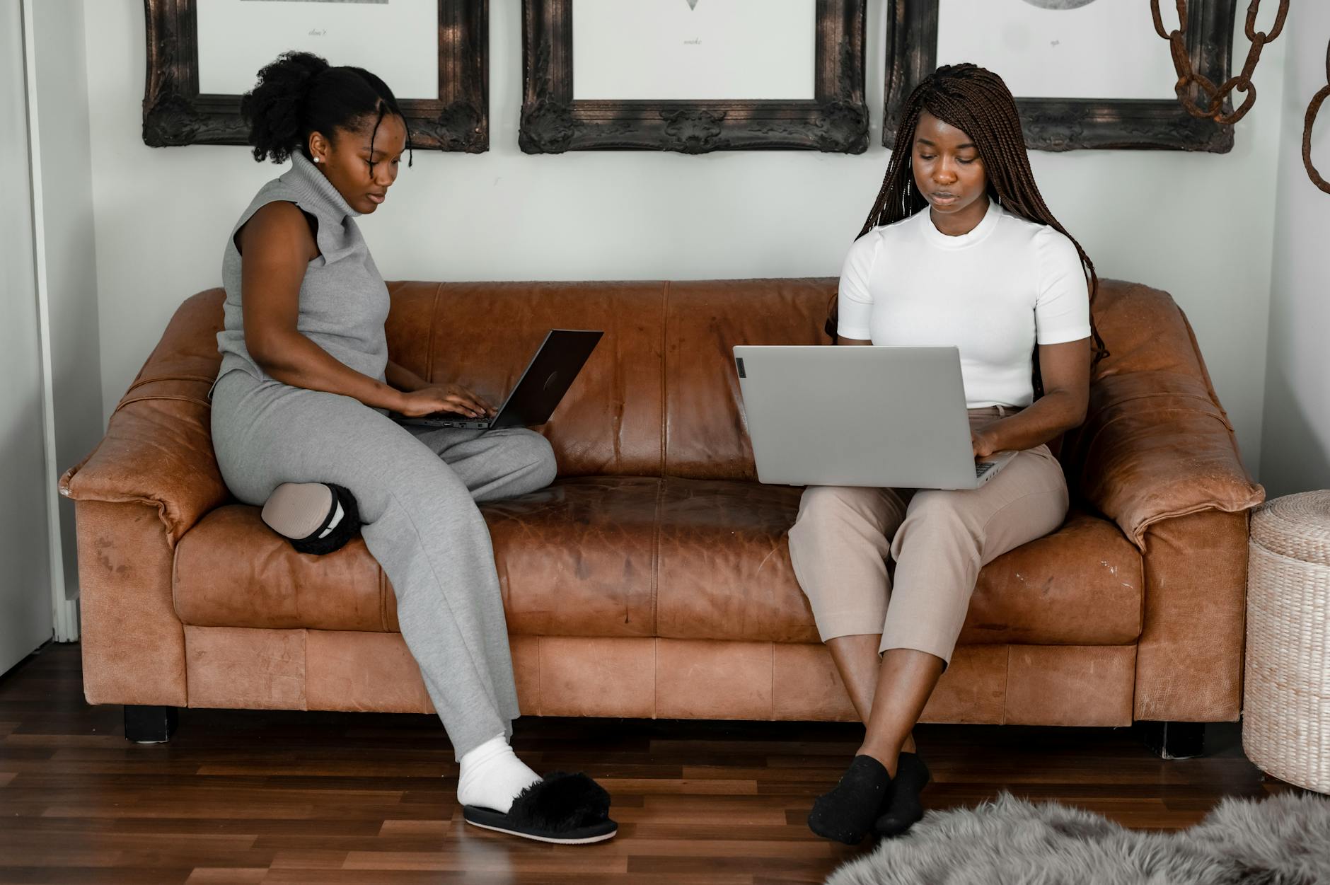 women working while sitting on the couch
