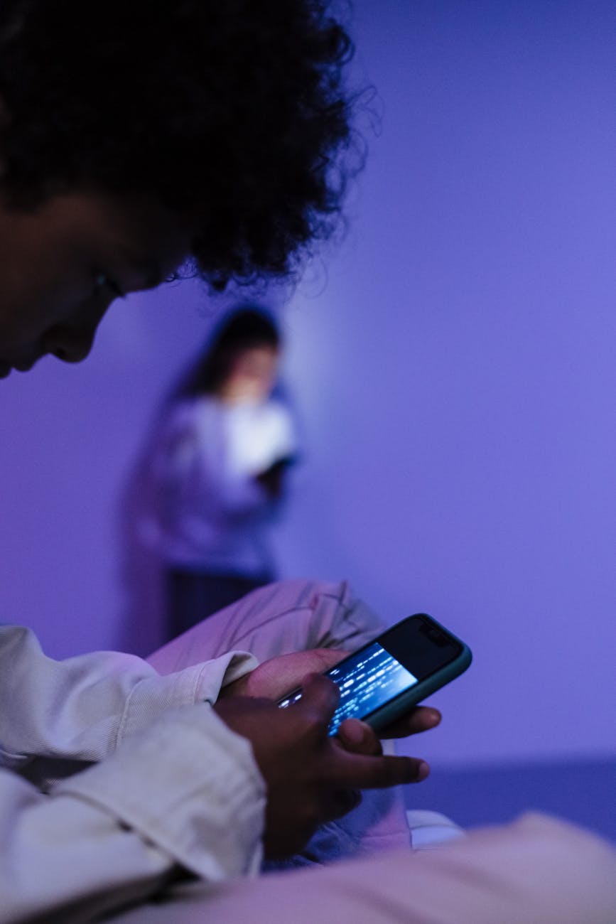 close up shot of a kid using a smartphone