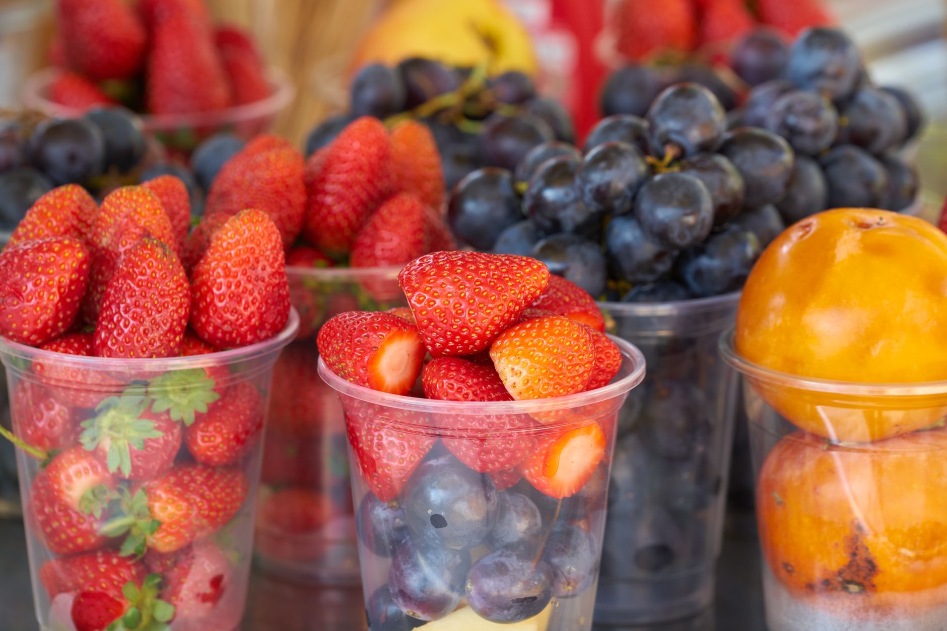 cup of strawberries and mixed fruits