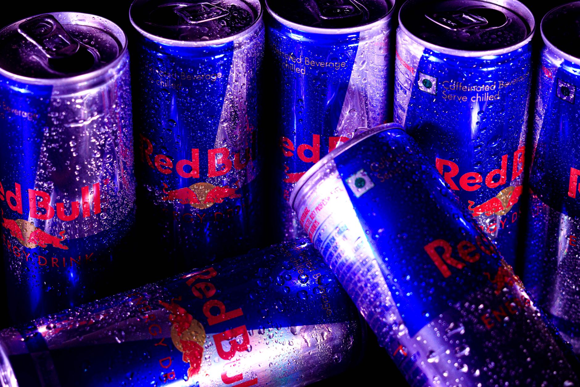 close up of red bull cans