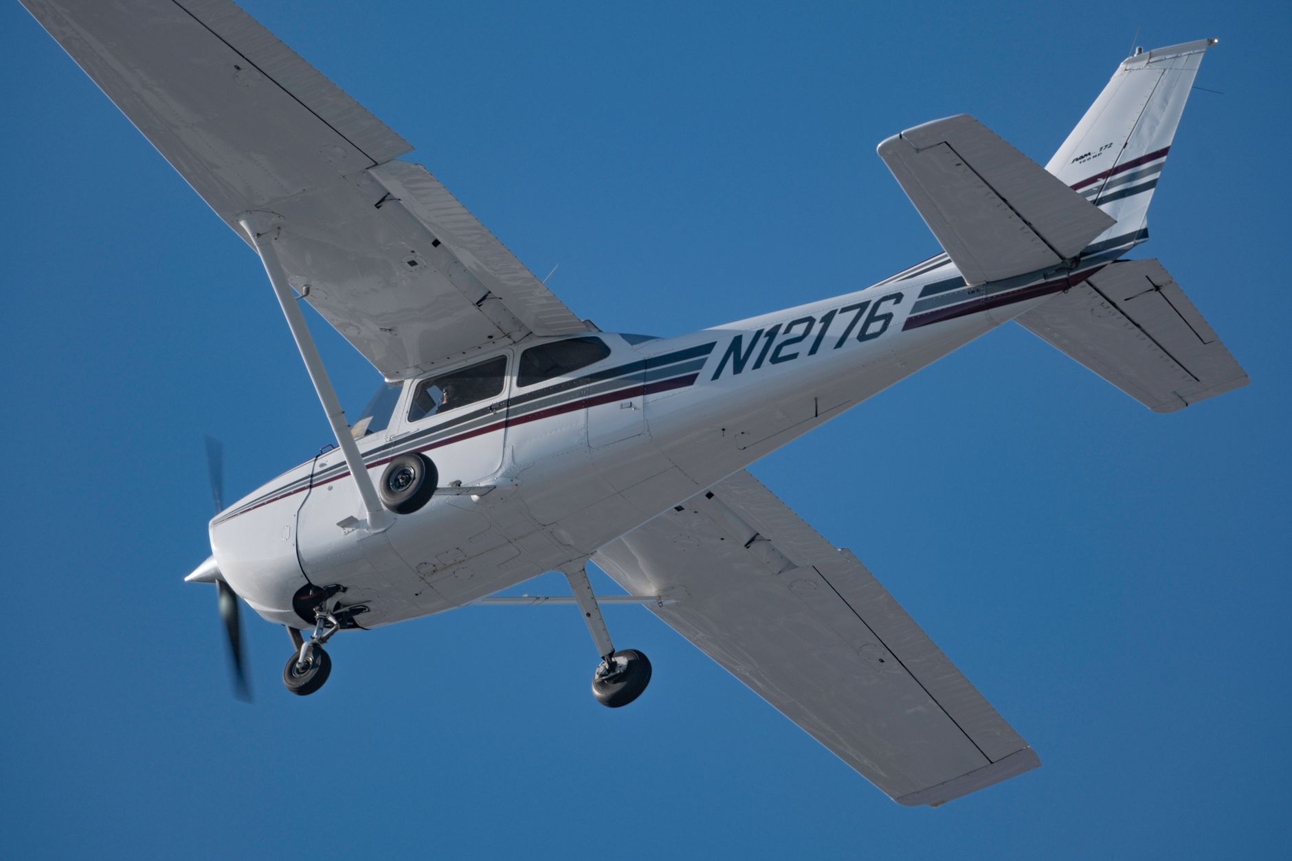 light aircraft flying high in clear kentucky sky
