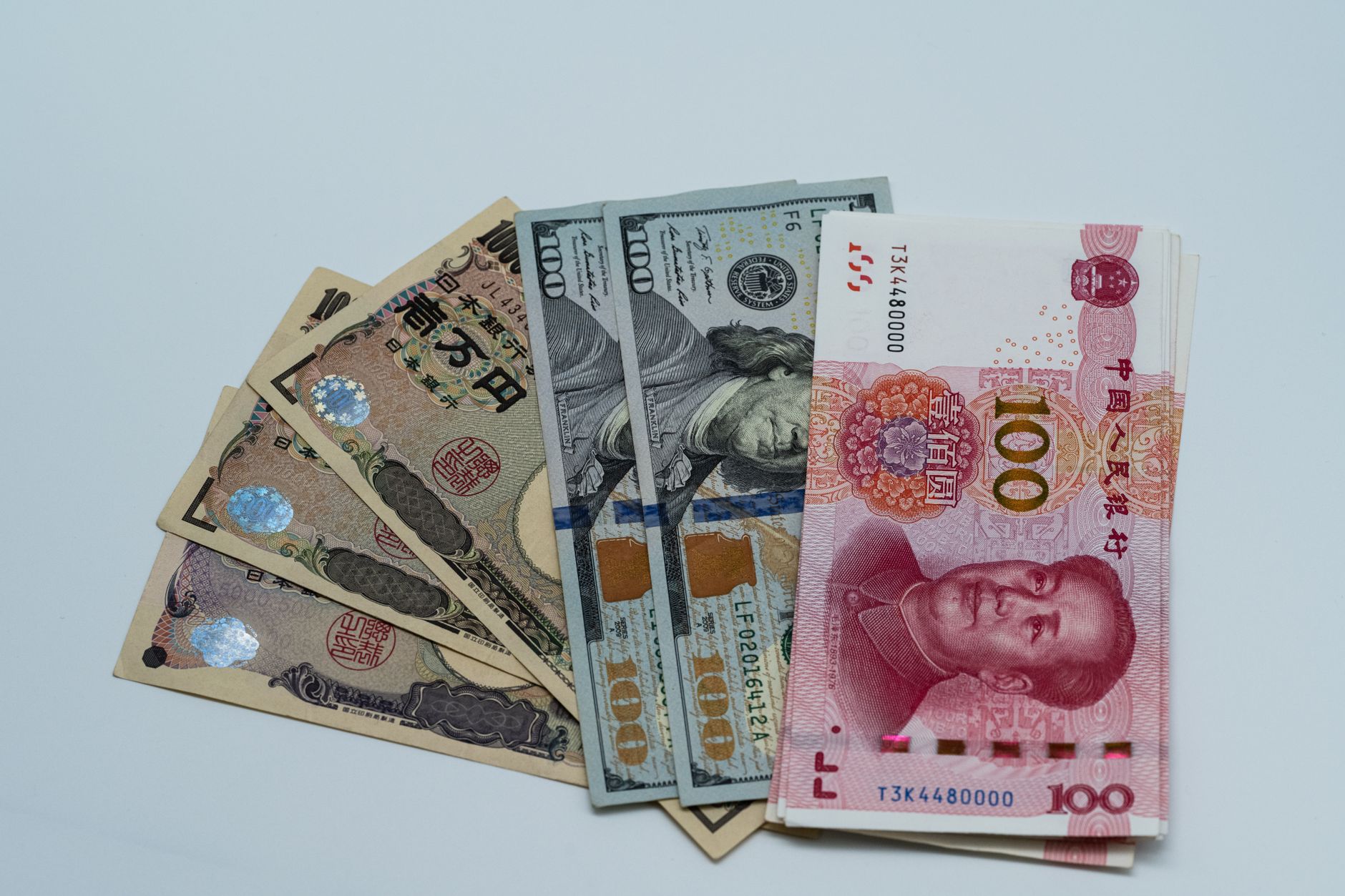 assorted international currency bills on display
