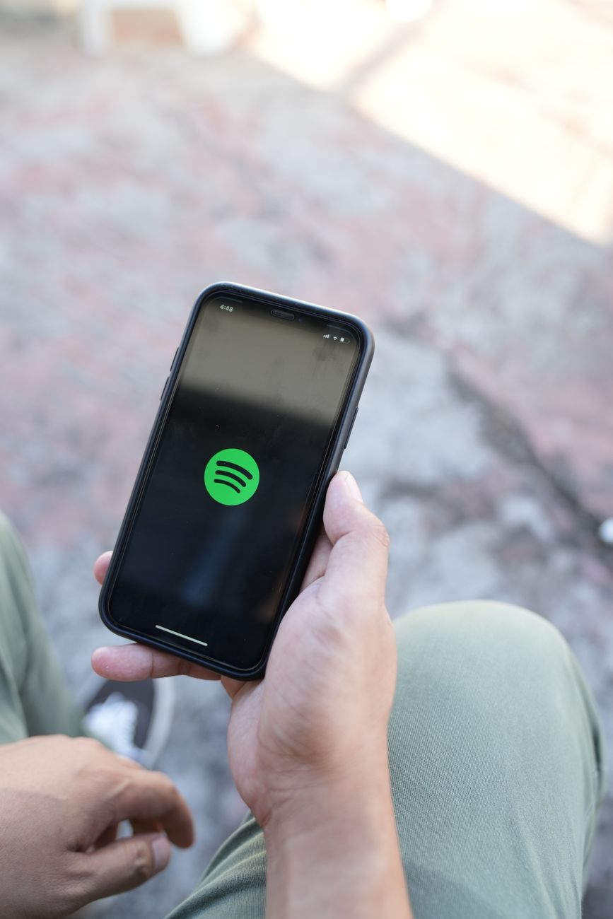 spotify app on phone in hand